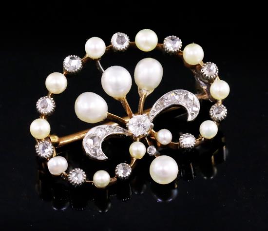 An Edwardian pearl and diamond set demi-lune drop openwork brooch, 27mm.